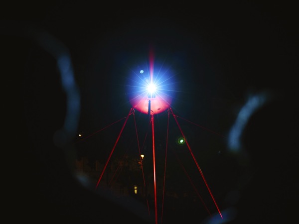 OKO installed outdoors projecting onto architectural surface