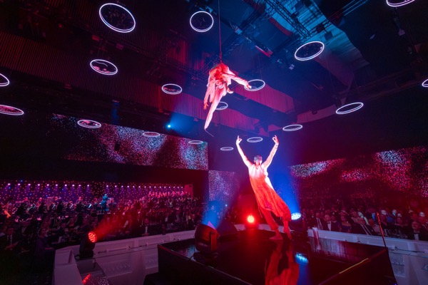 Summit audience experiencing immersive generative projection