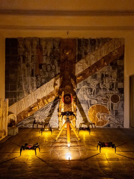 System installation view with multiple robots navigating dark space